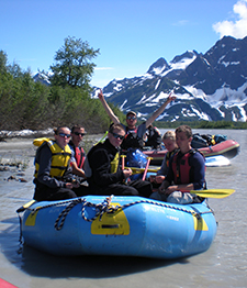 APU Students rafting on a beautiful Alaskan river.