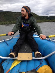 John Bouman, an Expedition Alaska teaching assistant, takes to the upper Matanuska River to test gear and standard paddle signals so that rafters may stay in touch for safety.