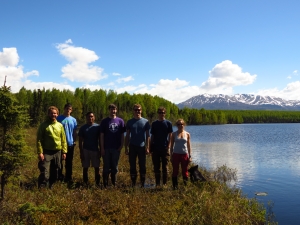 Group of APU students next to beautiful Alaskan lake.