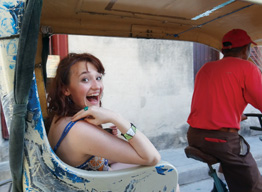 A student in a rickshaw, studying abroad.