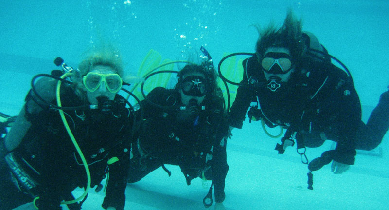 Three students diving.