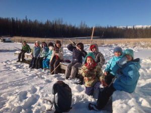 Farm school kids learning outdoors in the winter.
