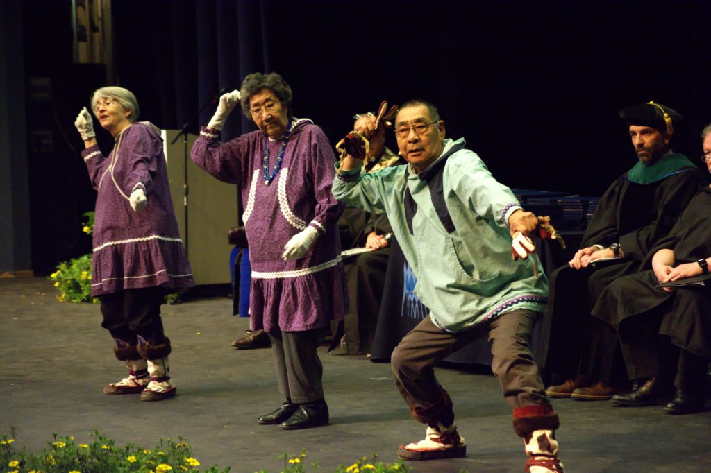 Group of three Alaska Native dancers performing during Spring 2017 APU Graduation Ceremony