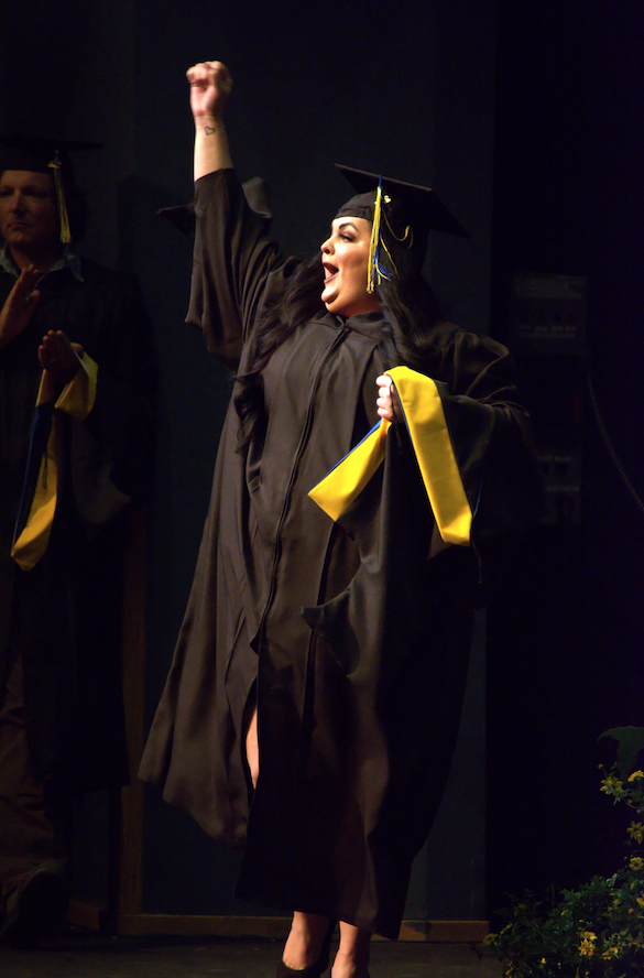 Excited APU Graduate receiving her diploma