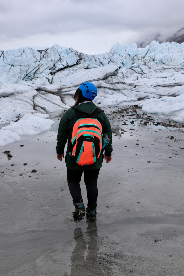 Student with glacial ice in the background.
