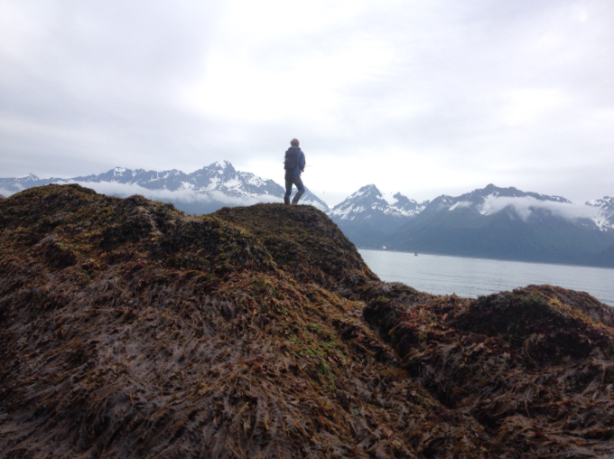 Student with beautiful Resurrection Bay in the background in Seward, Alaska