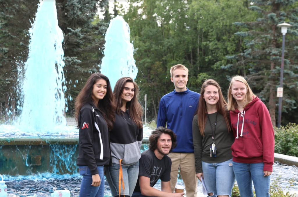 Students posing with the blue fountain.