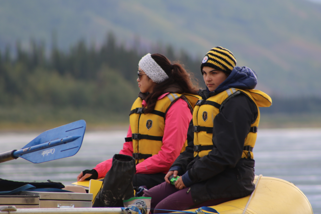 Students riding in the raft on the Yukon River.
