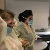 Nursing students in protective wear