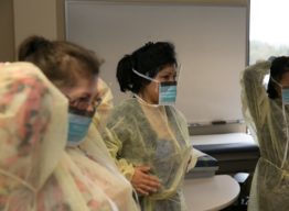 Nursing students in protective wear