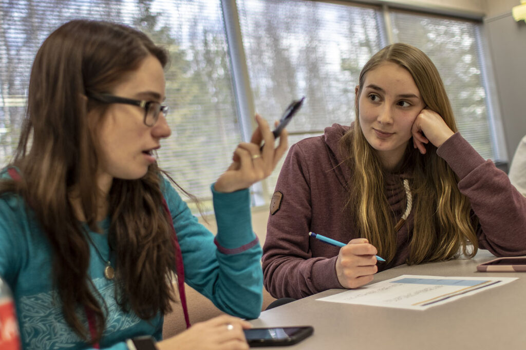 Students work through talking points in their Public Speeking class in the Carr Gottstein building on the campus of APU.