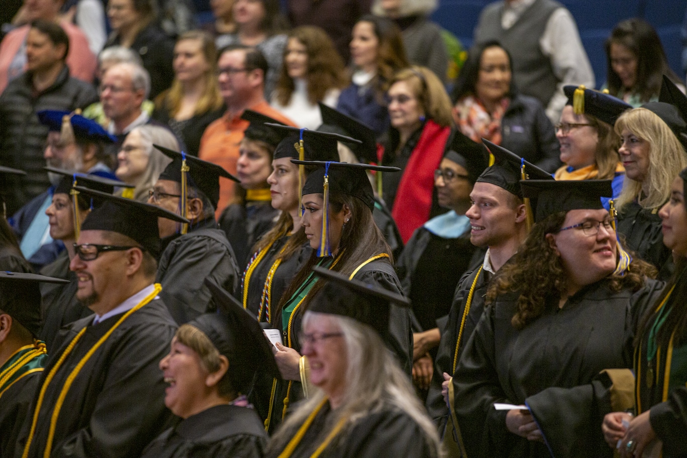 APU grads walk in the fall 2019 Commencement ceremony at the Wendy Williamson Auditorium on the campus of the University of Alaska, Anchorage on December 14, 2019.