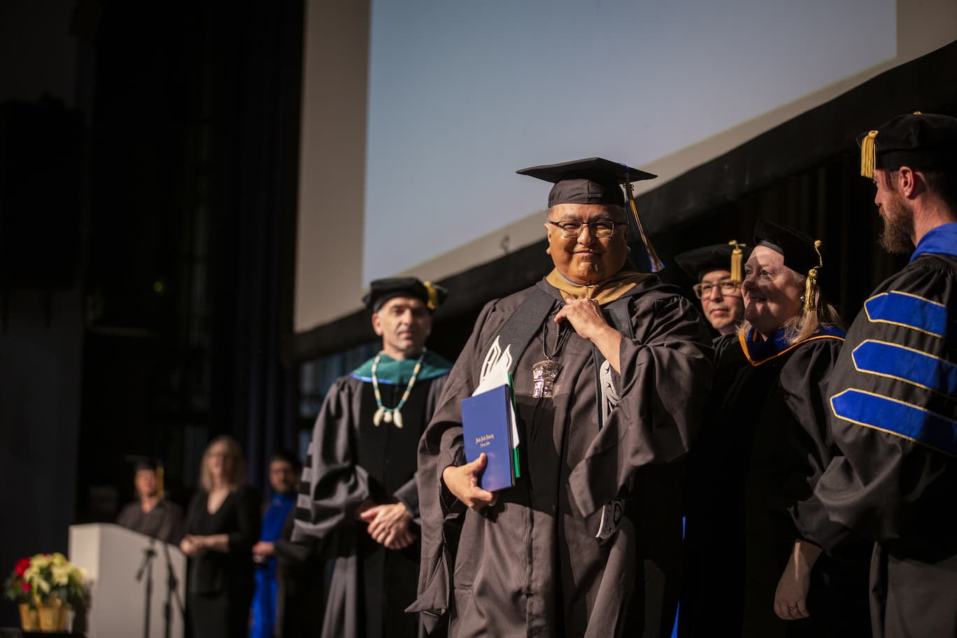 APU grads walk in the fall 2019 Commencement ceremony at the Wendy Williamson Auditorium on the campus of the University of Alaska, Anchorage on December 14, 2019.