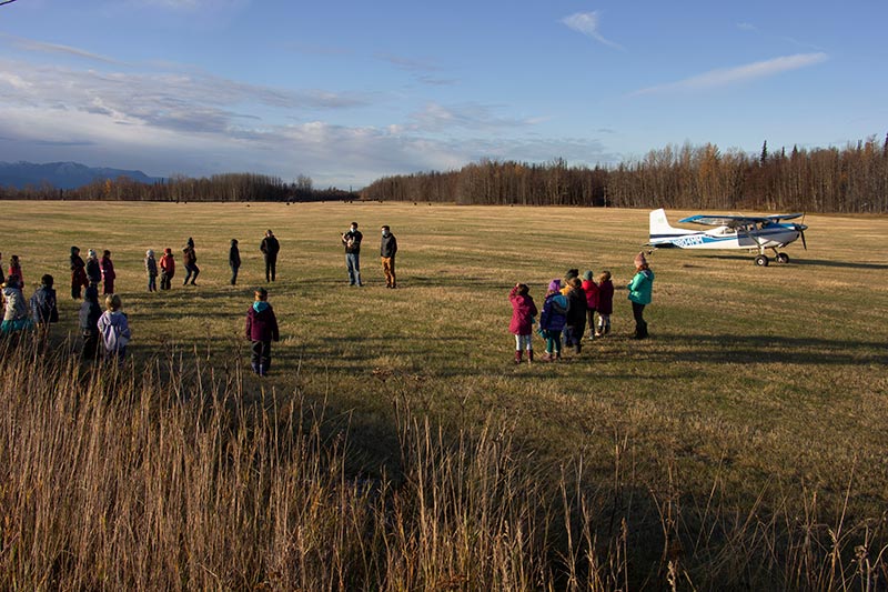 Pilots teaching FIELD School students about flight
