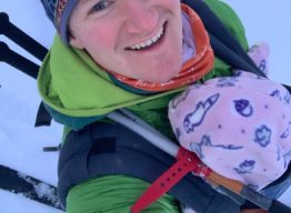 Will Elliott, writing professor, skiing with his child