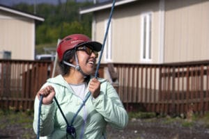 Kim A. belays a classmate at Burchell High School's ropes course