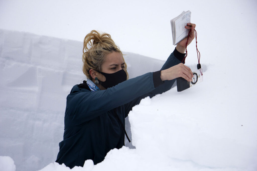 woman working on snow science