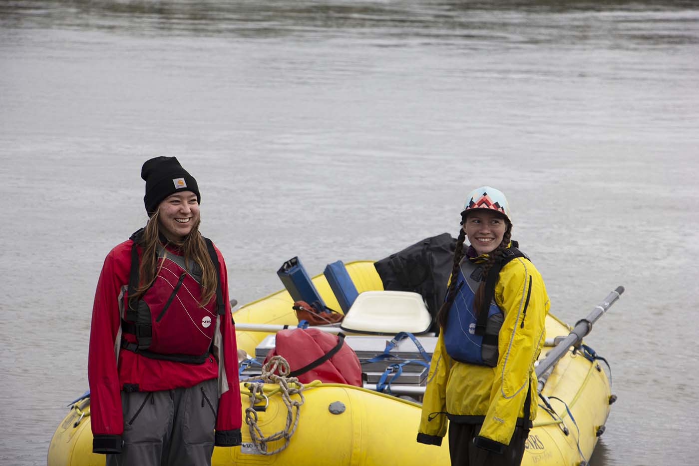 female students preparing rafts for Expedition Alaska