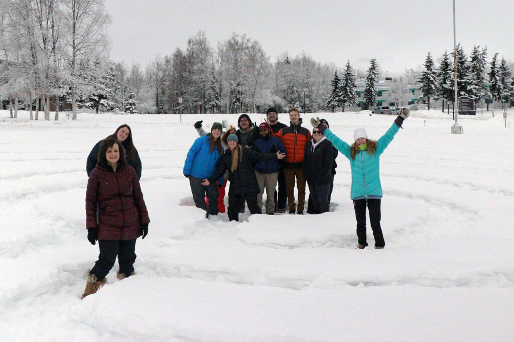 team photo of students in the snow
