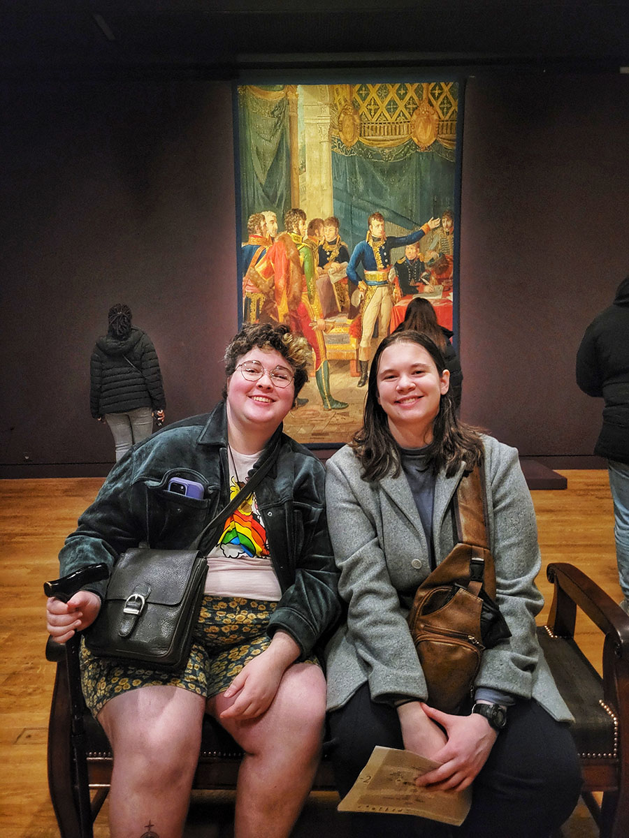 two women sitting in the museum