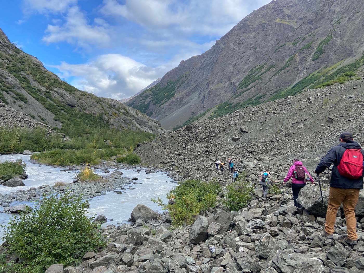 students backpacking in the summer