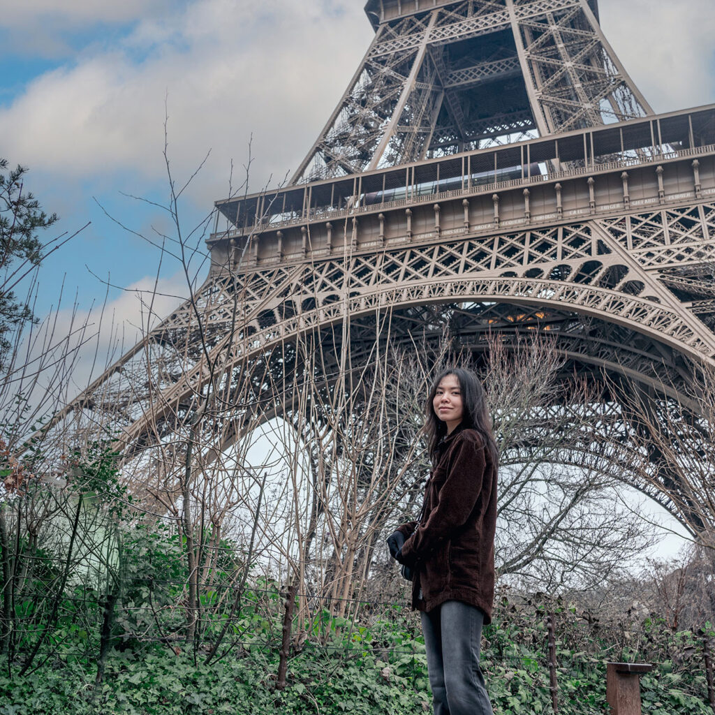 female student in front of Eiffel Tower