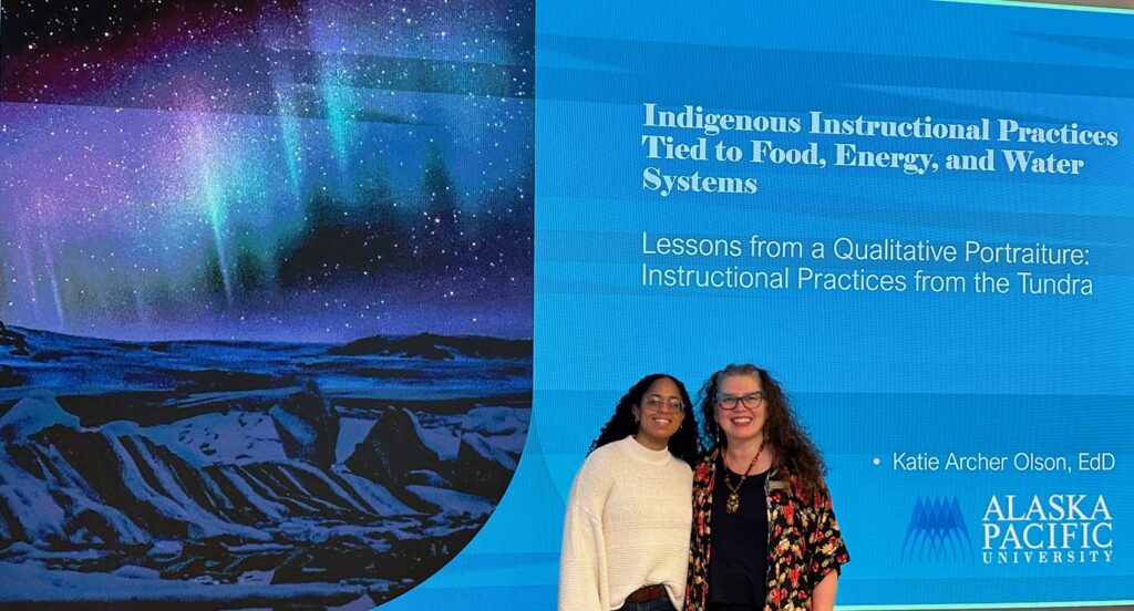 two woman posing at conference