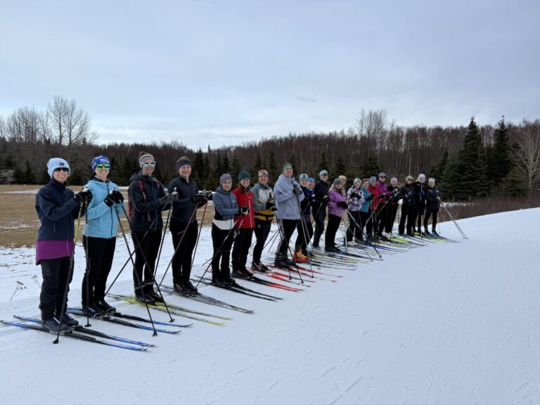 xc skiers getting ready to start skiing