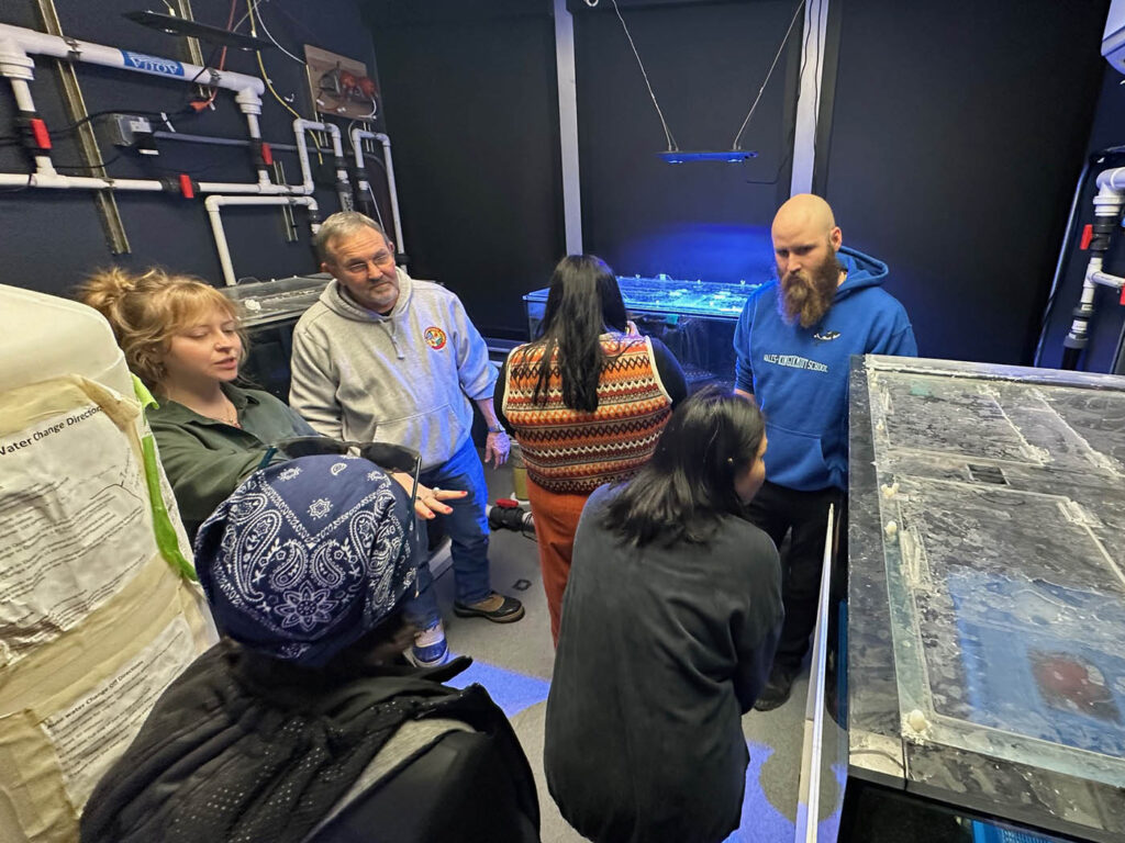 group of people looking around indoors