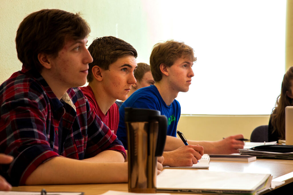 psychology students taking notes in the classroom