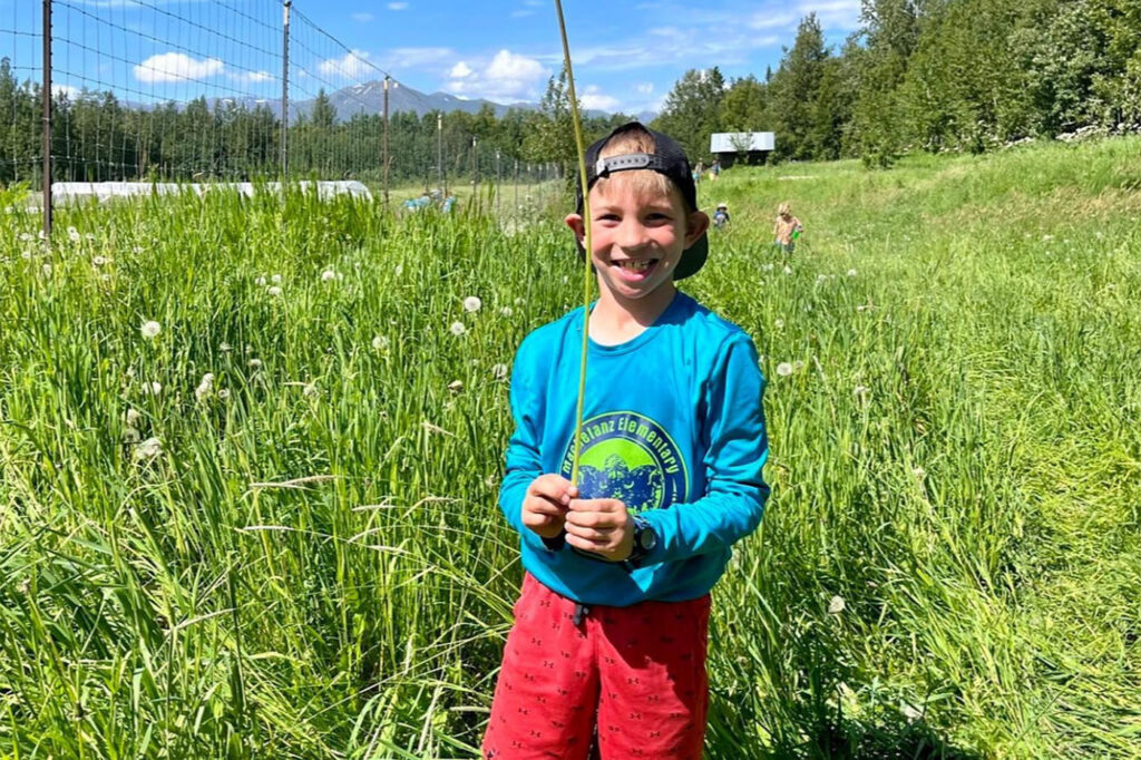 boy smiling at camp Kellogg