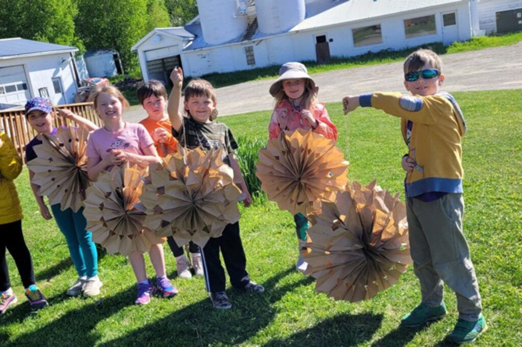 kids showing crafts at camp Kellogg