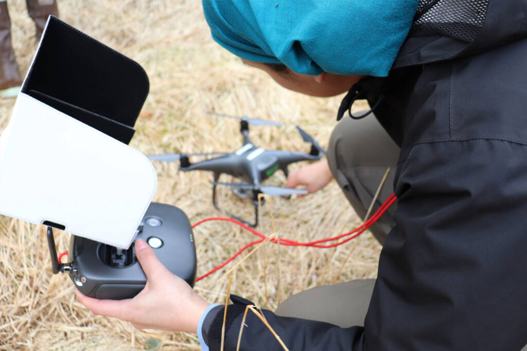 person setting up a drone