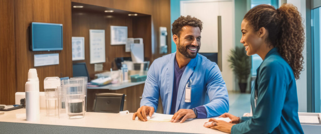 two people at clinic reception, talking
