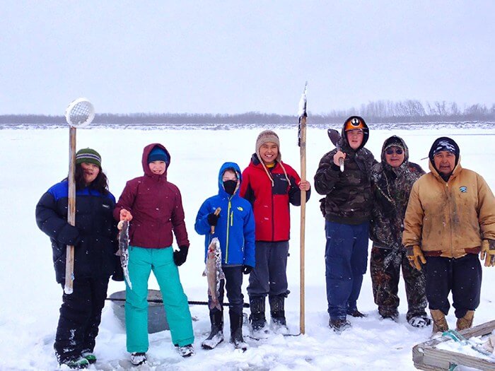 group of people ice fishing